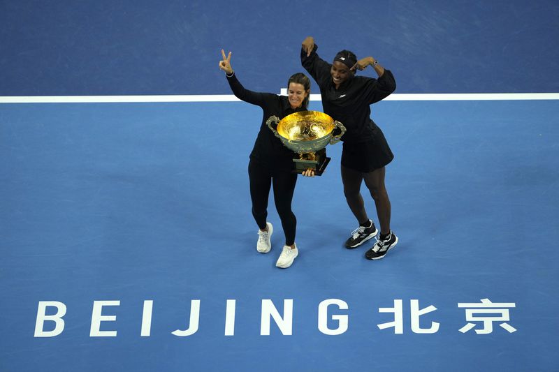 Coco Gauff of the United States celebrates with her trainer Mery Vago after defeating Karolina Muchova of Czech Republic in the women's singles final match at the China Open tennis tournament at the National Tennis Center in Beijing, Sunday, Oct. 6, 2024. (AP Photo/Ng Han Guan)