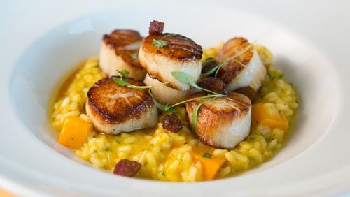 The Georges Bank sea scallops dish at Seed Kitchen & Bar is a favorite dish among customers.