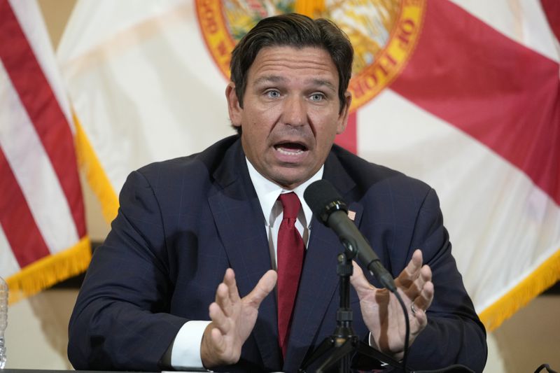 Florida Gov. Ron DeSantis gestures as he answers questions after a roundtable discussion at the Roberto Alonso Community Center, Monday, Sept. 9, 2024, in Miami Lakes, Fla. (AP Photo/Wilfredo Lee)