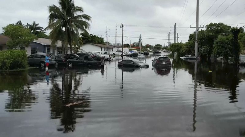 This arial view taken from video shows multiple cars stranded on a road in Northeast Miami-Dade County on Thursday, June 13, 2024. A tropical disturbance brought a rare flash flood emergency to much of southern Florida the day before. Floridians prepared to weather more heavy rainfall on Thursday and Friday. (AP Photo/Daniel Kozin)