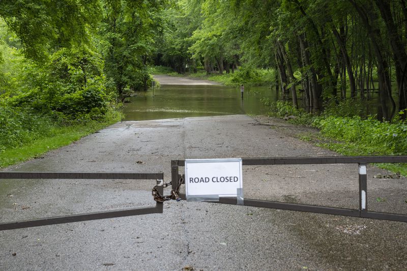 Water from the Minnesota River floods Picnic Island Rd. inside Fort Snelling State Park in St. Paul, Minn., on Thursday, June 20, 2024. (Alex Kormann/Star Tribune via AP)