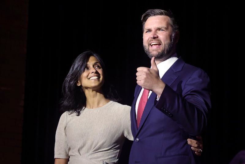 FILE - Republican vice presidential candidate Sen. JD Vance, R-Ohio, right, takes the stage with his wife Usha Vance during a rally in his home town of Middletown, Ohio, July 22, 2024. (AP Photo/Paul Vernon, File)