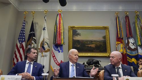 President Joe Biden speaks during a briefing on the government's response to Hurricane Helene in the Roosevelt Room of the White House in Washington, Tuesday, Oct. 1, 2024, as Secretary of Transportation Pete Buttigieg, left, and Secretary of Homeland Security Alejandro Mayorkas, right, look on. (AP Photo/Mark Schiefelbein)