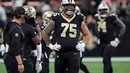 New Orleans Saints offensive tackle Taliese Fuaga (75) looks up at the scoreboard after the Philadelphia Eagles stopped the Saints' final drive with an interception in the fourth quarter of an NFL football game in New Orleans, Sunday, Sept. 22, 2024. (AP Photo/Gerald Herbert)