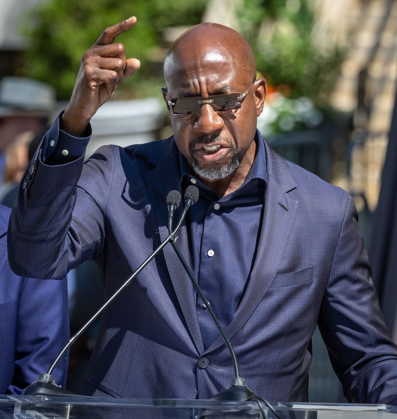 Senator Reverend Raphael Warnock speaks to the crowd during the statue unveiling ceremony honoring the late Congressman John Lewis in Decatur on Saturday, Aug 24, 2024. (Steve Schaefer / AJC)