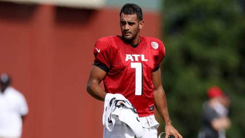 Falcons quarterback Marcus Mariota takes a break during training camp at the Falcons Practice Facility, Wednesday, August 10, 2022, in Flowery Branch, Ga. (Jason Getz / Jason.Getz@ajc.com)