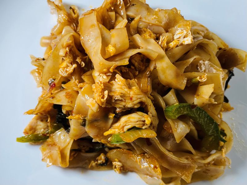Pad Kee Mao “drunken noodles” are stir fried with vegetables, egg and chili sauce. 
Bob Townsend for the Atlanta Journal-Constitution.