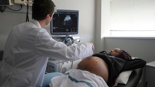 Areana Coles receives an ultrasound during a prenatal visit at the Oklahoma State University obstetrics and gynecology clinic in Tulsa, Okla., on Tuesday, July 16, 2024. (AP Photo/Mary Conlon)