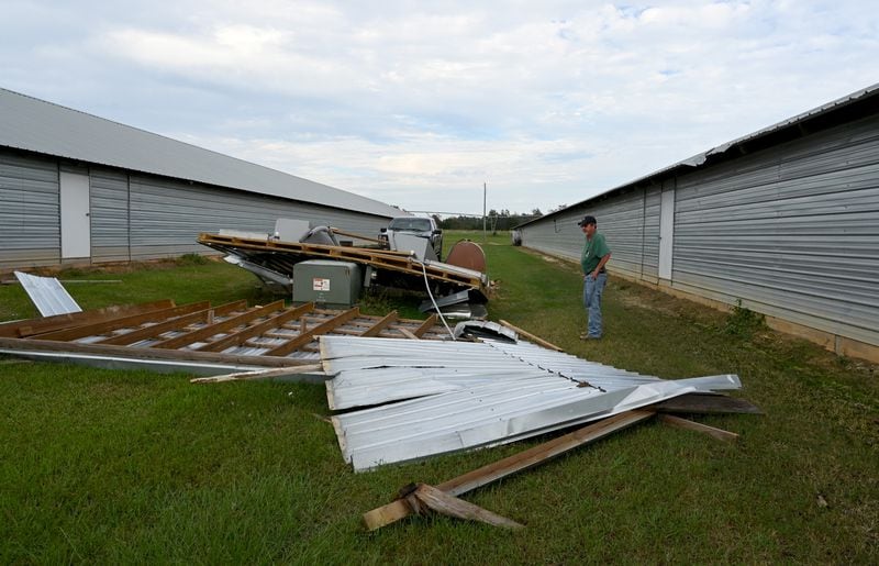 Doug Harper shows damaged generator pieces caused by Hurricane Helene outside his chicken houses, Tuesday, October 1, 2024, in Nashville, Ga. Harper lost his chickens after his property lost power. (Hyosub Shin / AJC)