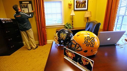 Two of the choices for Kennesaw State's football helmet sit on coach Brian Bohannon's desk.