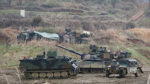 U.S. Army troops conduct a military exercise in Paju, near the border with North Korea, South Korea, Friday, April 14, 2017. President Donald Trump's tweets are adding fuel to a vicious cycle of tensions on the Korean Peninsula and if the U.S. shows any sign of "reckless" military aggression Pyongyang is ready to launch a pre-emptive strike of its own, North Korea's vice foreign minister told The Associated Press in an exclusive interview Friday. (AP Photo/Ahn Young-joon)