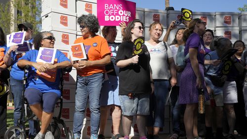 FILE - Arizona abortion-rights supporters gather for a news conference prior to delivering over 800,000 petition signatures to the capitol to get abortion rights on the November general election ballot, July 3, 2024, in Phoenix. (AP Photo/Ross D. Franklin, File)