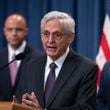 Attorney General Merrick Garland, flanked by Matt Graves, U.S. attorney for the District of Columbia, left, and Ronald Davis, director of the United States Marshals Service, holds a news conference as the Justice Department announced criminal charges against Iranian operatives suspected of hacking Donald Trump's presidential campaign and disseminating stolen information to media organizations, at the Justice Department in Washington, Friday, Sept. 27, 2024. (AP Photo/J. Scott Applewhite)