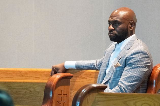 Nathan Wade listens as Fulton County DA Fani Willis addresses the Sixth Episcopal District of the African Methodist Episcopal Church in Marietta on June 13, 2024. (Ben Gray / Ben@BenGray.com)