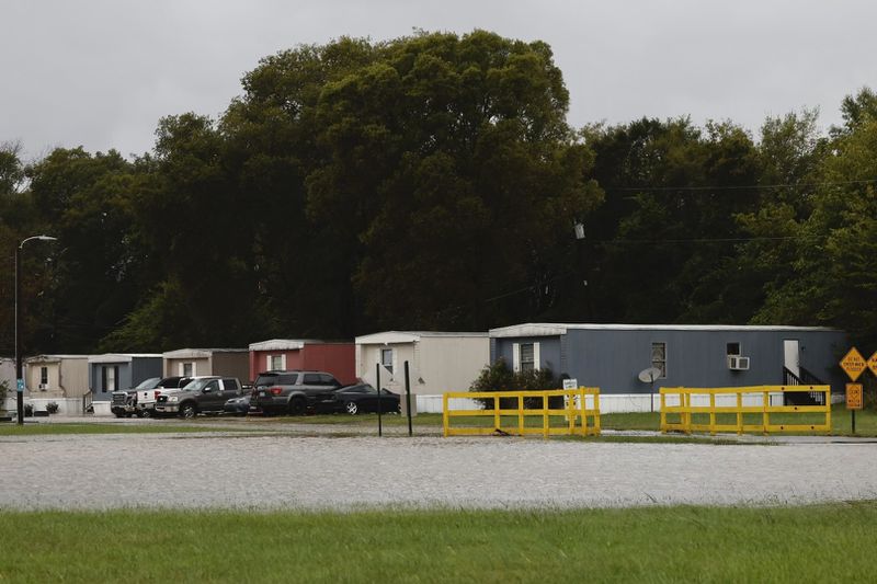 Arrowood Mobile Home Park in Steele Creek is flooded after Hurricane Helen passed the area Friday, Sept. 27, 2024 in Charlotte, N.C. (Melissa Melvin-Rodriguez/The Charlotte Observer via AP)