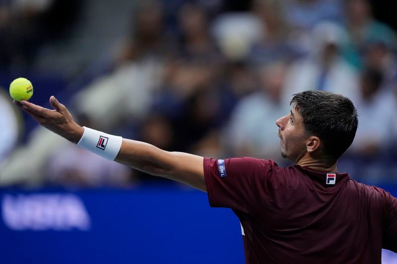 Alexei Popyrin, of Australia, serves to Novak Djokovic, of Serbia, during a third round match of the U.S. Open tennis championships, Friday, Aug. 30, 2024, in New York. (AP Photo/Julia Nikhinson)