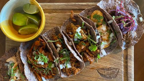 Tacos at D Boca N Boca include (from left) chicken, mushroom, chorizo, al pastor, shrimp and beef. Ligaya Figueras/ligaya.figueras@ajc.com