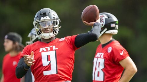 Falcons quarterback Michael Penix Jr. (9) practices during training camp at the Falcons’ headquarters in Flowery Branch on Friday, July 26, 2024. (Arvin Temkar / AJC)