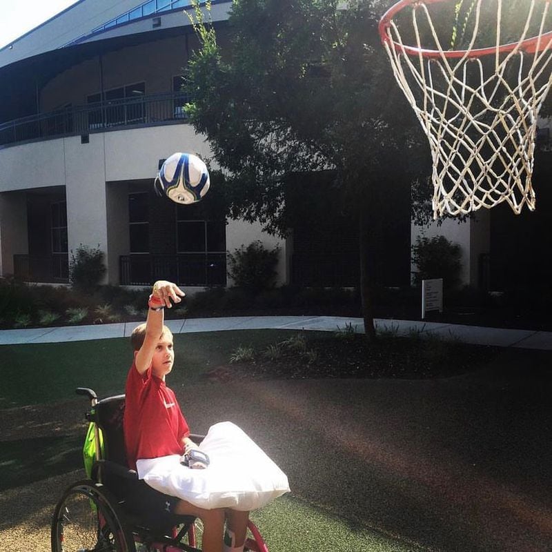 Jonathan Campbell shoots a basket shortly after having a stroke at age 11. Now seven years later, he's about to graduate from Harrison High School. (Photo courtesy Tammy Campbell)
