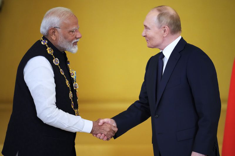 Russian President Vladimir Putin awards Indian Prime Minister Narendra Modi with the Order of St. Andrew the Apostle the First-Called at the Kremlin in Moscow, Russia, Tuesday, July 9, 2024. (AP Photo/Alexander Zemlianichenko)
