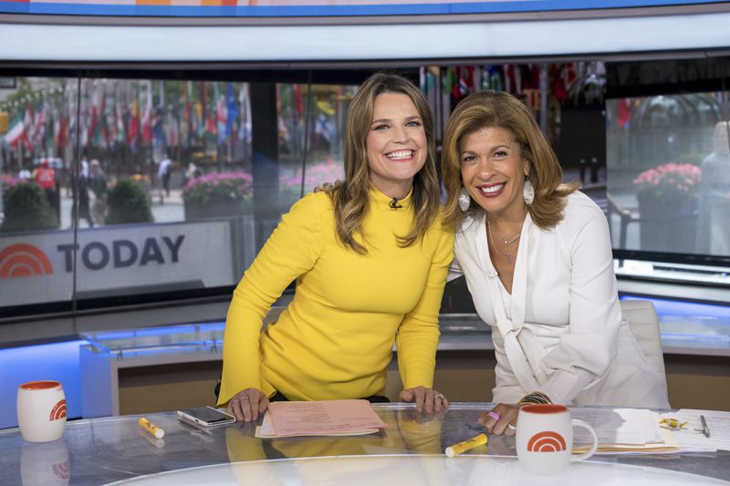 FILE - Co-anchors Savannah Guthrie, left, and Hoda Kotb pose on set of the "Today" show at NBC Studios on Wednesday, June 27, 2018, in New York. (Photo by Charles Sykes/Invision/AP, File)