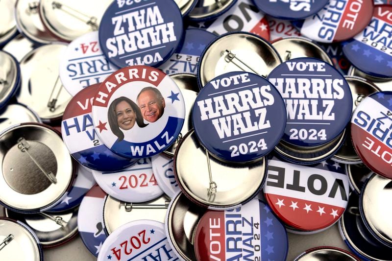 Campaign pins for sale are pictured before a campaign rally for Democratic presidential nominee Vice President Kamala Harris at the Dort Financial Center in Flint, Mich., Friday, Oct. 4, 2024. (AP Photo/Carolyn Kaster)