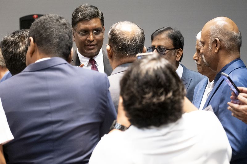 Consul General of India to Atlanta Shri Ramesh Babu Lakshmanan talks with attendees during a break in a trade event hosted by the Georgia Indo-American Chamber of Commerce in Atlanta on Wednesday, March 27, 2024.   (Ben Gray / Ben@BenGray.com)