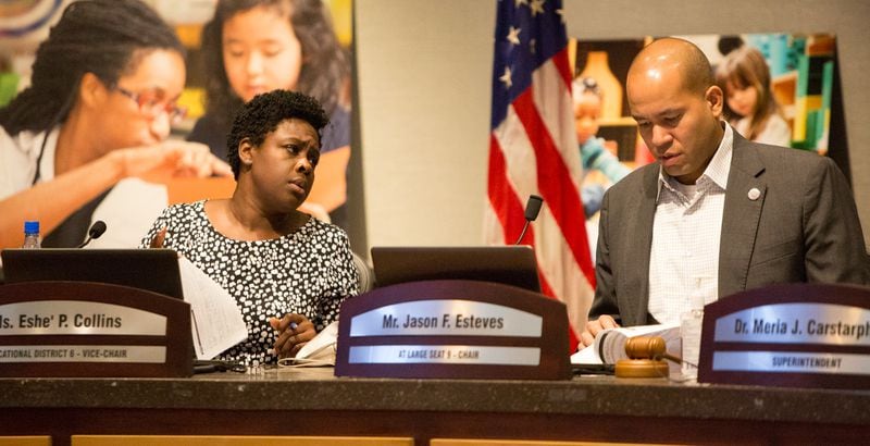 The Atlanta school board  vice chair Eshe' Collins (left) and chairman Jason Esteves chat before a special meeting on Monday, Sept. 9, 2019, to discuss whether to extend superintendent Meria Carstarphen's contract. (Photo by Phil Skinner).