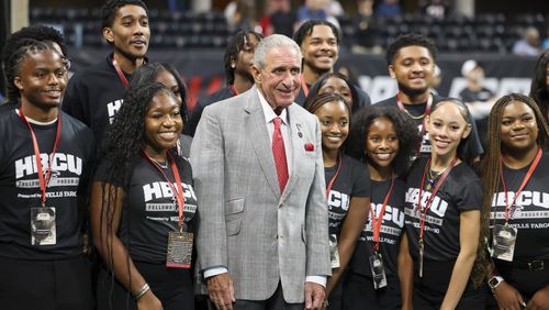 Atlanta Falcons owner Arthur Blank poses for a photograph with fans before the Falcons’ preseason NFL game against the Jacksonville Jaguars at Mercedes-Benz Stadium, on Friday, Aug. 23, 2024, in Atlanta. (Jason Getz / AJC)
