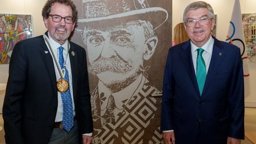 George Hirthler (left) receives Coubertin Medal from IOC President Thomas Bach on June 23, 2022.