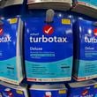 Intuit TurboTax packages are seen on display in a Costco Warehouse The company, which bought Atlanta-based Mailchimp in 2021, said Wednesday it is laying off about 10% of its workforce. (AP Photo/Gene J. Puskar, File)