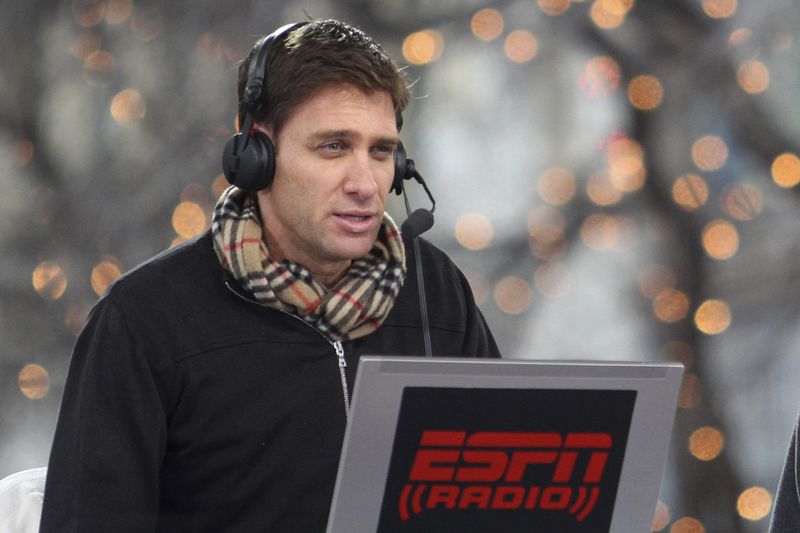 FILE - ESPN Radio's Mike Greenberg, left, and Mike Golic, not pictured, broadcast "Mike and Mike In The Morning" as they begin Super Bowl broadcasting from their studio set on Main Street in downtown Fort Worth, Texas, Jan. 31, 2011. (Paul Moseley/Star-Telegram via AP, File)