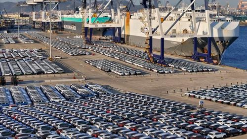 FILE - New cars for export wait for transportation on a vehicles carrier vessel at a dockyard in Yantai in east China's Shandong province on Nov. 2, 2023. Chinese auto sales slumped in June, 2024 as the domestic economy remains weak, but strong exports kept overall sales growth in positive territory, an industry association said Wednesday, July 10, 2024. (Chinatopix via AP, File)