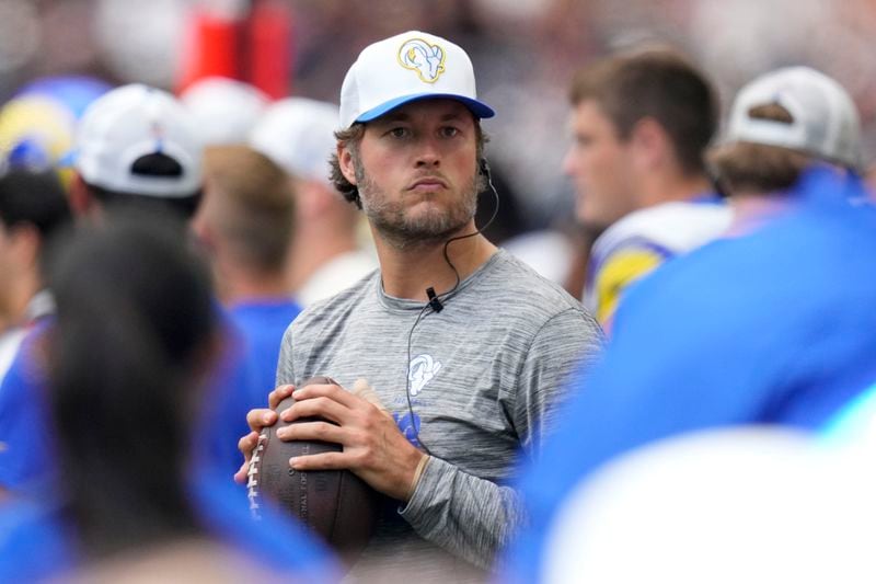 Los Angeles Rams quarterback Matthew Stafford throws on the sideline during the second half of a preseason NFL football game against the Houston Texans, Saturday, Aug. 24, 2024, in Houston. (AP Photo/Eric Gay)