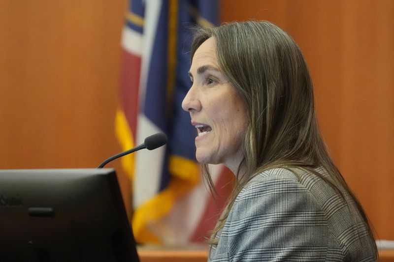 Forensic accountant Brooke Karrington testifies during a hearing for Kouri Richins, a Utah mother of three who wrote a children's book about coping with grief after her husband's death and was later accused of fatally poisoning him, on Monday, Aug. 26, 2024, in Park City, Utah. (AP Photo/Rick Bowmer, Pool)