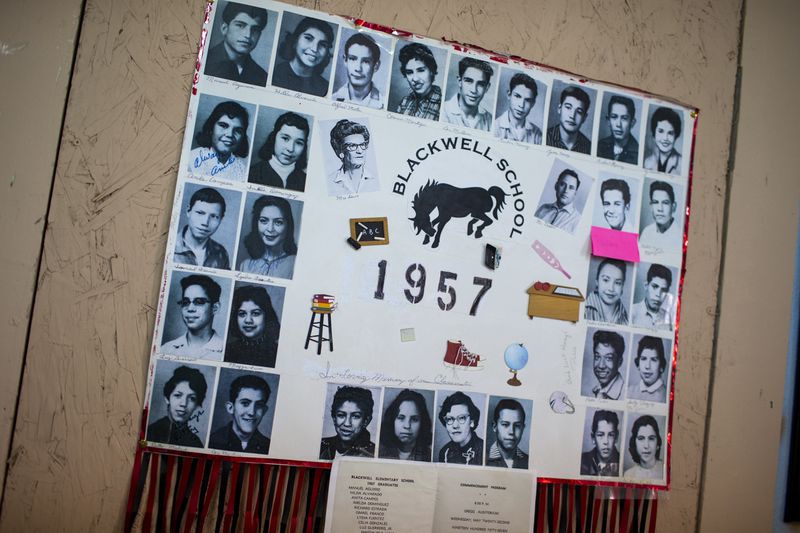 A display with photos of the 1957 class of the Blackwell School decorates the classroom during the inauguration day of the school as the newest National Historic Site in Marfa, Texas, Saturday, Sept. 14, 2024. (AP Photo/Andres Leighton)