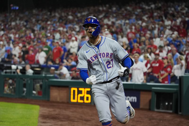 New York Mets' Mark Vientos celebrates hitting a two-run home run against Philadelphia Phillies pitcher Matt Strahm during the ninth inning of Game 2 of a baseball NL Division Series, Sunday, Oct. 6, 2024, in Philadelphia. (AP Photo/Chris Szagola)