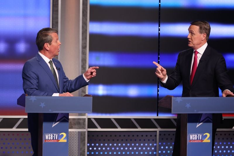 Former U.S. Sen. David Perdue, right, has opened debates by falsely claiming the 2020 presidential vote was “stolen,” a narrative former President Donald Trump has pursued in attacking Gov. Brian Kemp for not illegally overturning the results of the election in Georgia. Three recounts and a bipartisan group of officials have upheld the election. (Photo: Miguel Martinez/miguel.martinezjimenez@ajc.com)