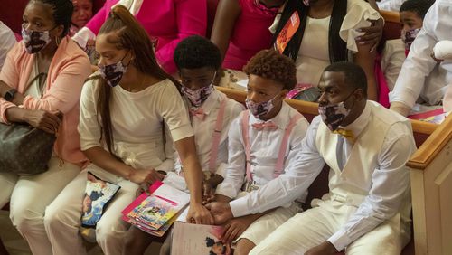 07/15/2020 - Atlanta, Georgia - Charmaine Turner (second from left), mother of Secoriea Turner and Secoriey Williamson (right), father of Secoriea Turner, comfort each other during the home-going service for Secoriea Turner at New Calvary Missionary Church in AtlantaÕs Sylvan Hills community, Wednesday, July 15, 2020. On July 4, 8-year-old Secoriea was shot dead by armed civilians who had commandeered a street in AtlantaÕs Peoplestown community. She was one of five individuals who were killed over the Independence Day Weekend in Atlanta. (ALYSSA POINTER / ALYSSA.POINTER@AJC.COM)