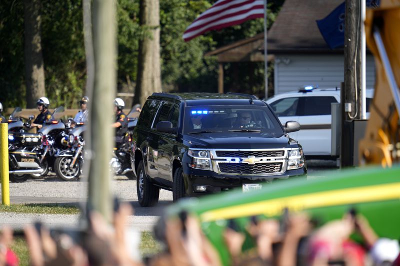 FILE - A motorcade with Republican presidential candidate former President Donald Trump arrives at a campaign event in Butler, Pa., July 13, 2024. (AP Photo/Gene J. Puskar, File)