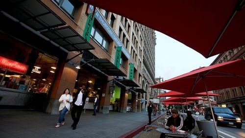 Umbrellas and chairs for dining along Broadway in front of the Grand Central Market in downtown Los Angeles. (Luis Sinco/Los Angeles Times/TNS)