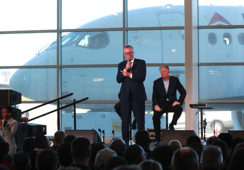 Delta CEO Ed Bastian (left) and COO Gil West unveil the new A220 aircraft while celebrating the 10-year anniversary of merging with Northwest at the Delta Air Lines TechOps on Monday, Oct 29, 2018, in Atlanta. Bastian has said an anti-union flyer circulated by management “wasn’t well crafted” but that the airlines was and always would be  pro-people. Curtis Compton/ccompton@ajc.com