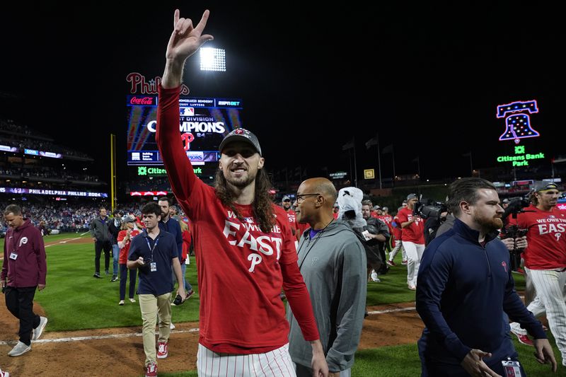 Philadelphia Phillies' Matt Strahm celebrates after winning a baseball game against the Chicago Cubs to clinch the NL East title, Monday, Sept. 23, 2024, in Philadelphia. (AP Photo/Matt Slocum)