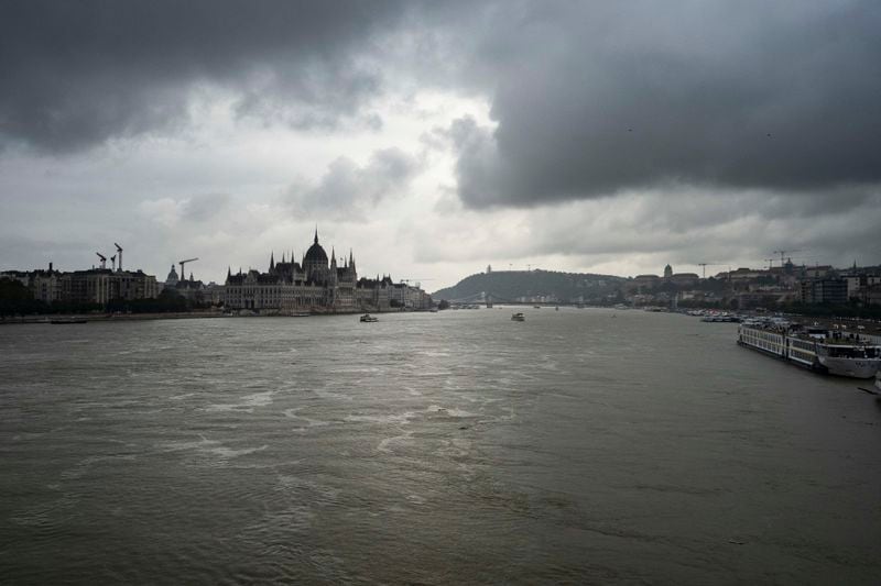 Dark clouds are seen over the Parliament building in Budapest, Hungary, during the flooding of the Danube river on Monday, Sept. 16, 2024. (AP Photo/Denes Erdos)