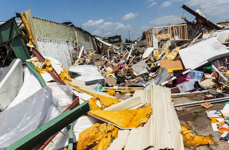 The Home Town Flea Market was severly damaged from the storm, Sunday, May 26, 2024, in Rogers, Ark. (Charlie Kaijo/The Northwest Arkansas Democrat-Gazette via AP)