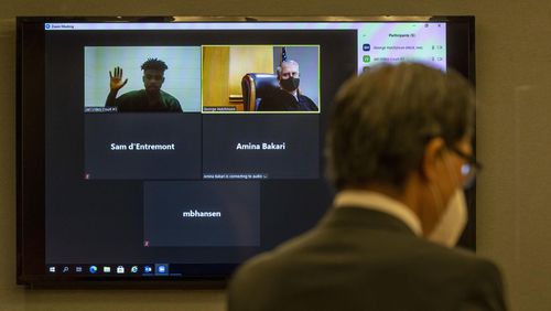 08/24/2020 - Lawrenceville, Georgia - Gwinnett County Chief Judge George F. Hutchinson III (to the right on screen) watches a Gwinnett County jail inmate gives his oath to tell the truth during a virtual court case conducted at the Gwinnett Justice and Administration Center in Lawrenceville, Monday, August 24, 2020. The cases were conducted over Zoom. (ALYSSA POINTER / ALYSSA.POINTER@AJC.COM)