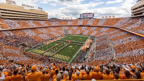 FILE - Tennessee players run onto the field at Neyland Stadium before an NCAA college football game between Tennessee and Texas A&M Saturday, Oct. 14, 2023, in Knoxville, Tenn. (AP Photo/Wade Payne, File)