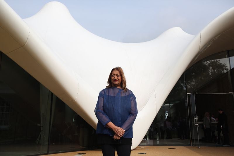 Architect Zaha Hadid poses for a photograph in front of the redeveloped Serpentine Sackler Gallery in Hyde Park on September 25 2013 in London, England.
