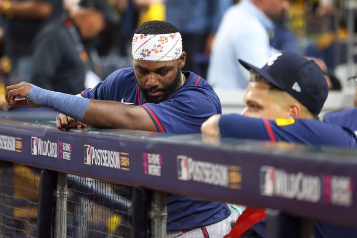 Atlanta Braves outfielder Michael Harris, left, reacts from the dugout with pitcher Joe Jiménez after losing to the San Diego Padres 5-4 in National League Division Series Wild Card Game Two at Petco Park in San Diego on Wednesday, Oct. 2, 2024. The Padres advance to the Division Series to face the Los Angeles Dodgers.  (Jason Getz / Jason.Getz@ajc.com)