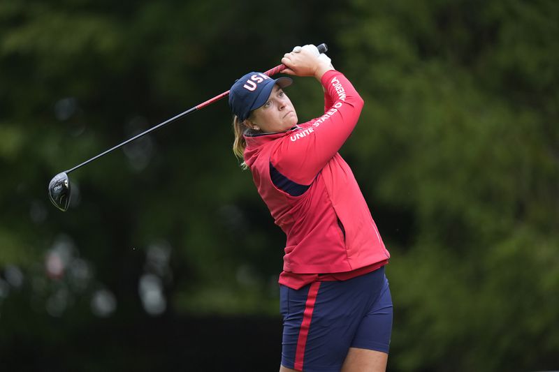 United States' Lauren Coughlin hits from the third tee during a Solheim Cup golf tournament foursomes match at Robert Trent Jones Golf Club, Friday, Sept. 13, 2024, in Gainesville, VA. (AP Photo/Chris Szagalo)